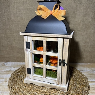 Candelabro marrón en tonos naranjas - Imagen 1